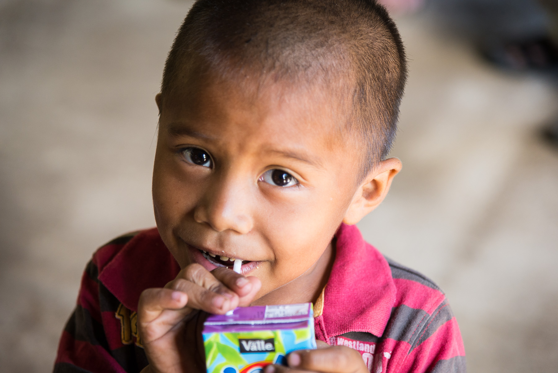 Child with juice box.