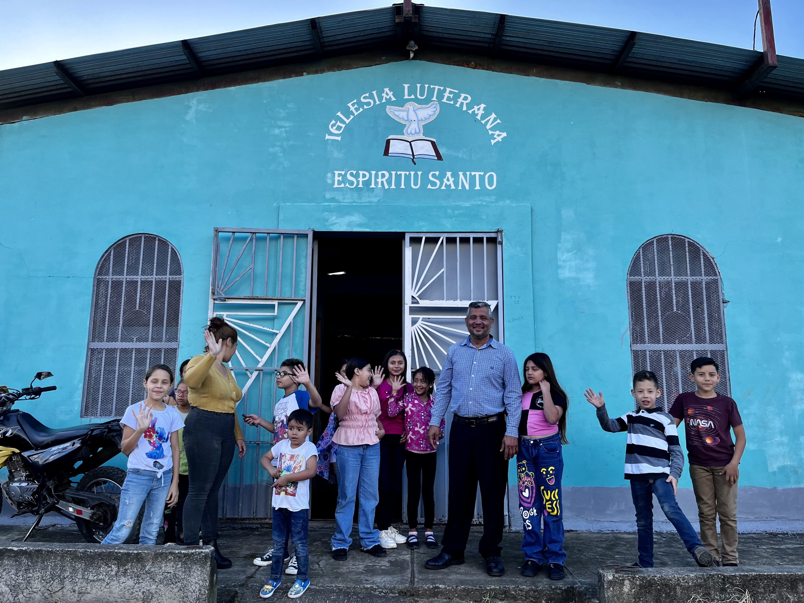 People gather outside church in Nicaragua.