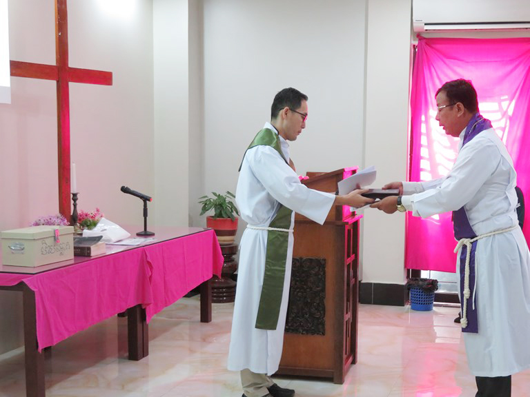 Two pastors in a worship service.