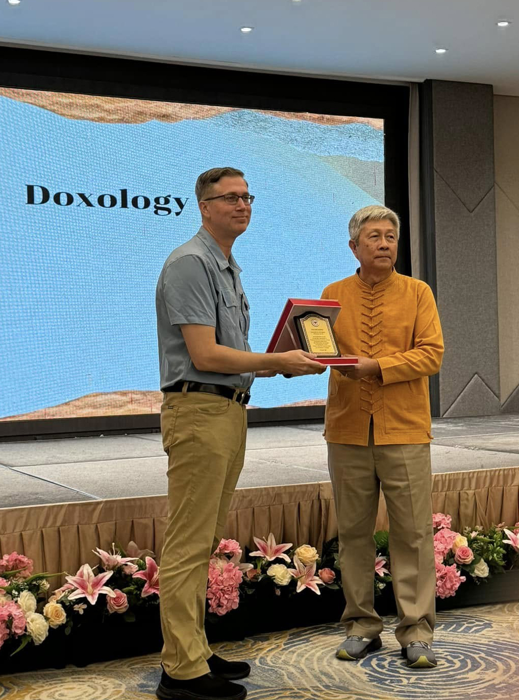 Pastor receiving plaque.
