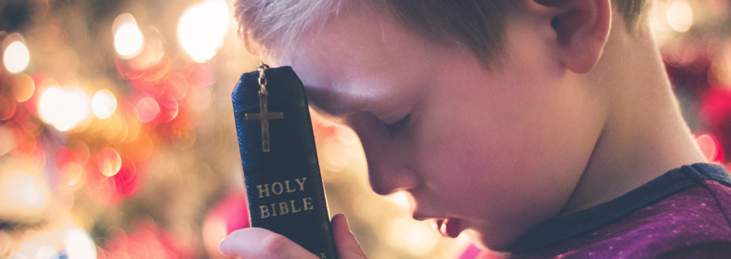 Young boy with Bible.